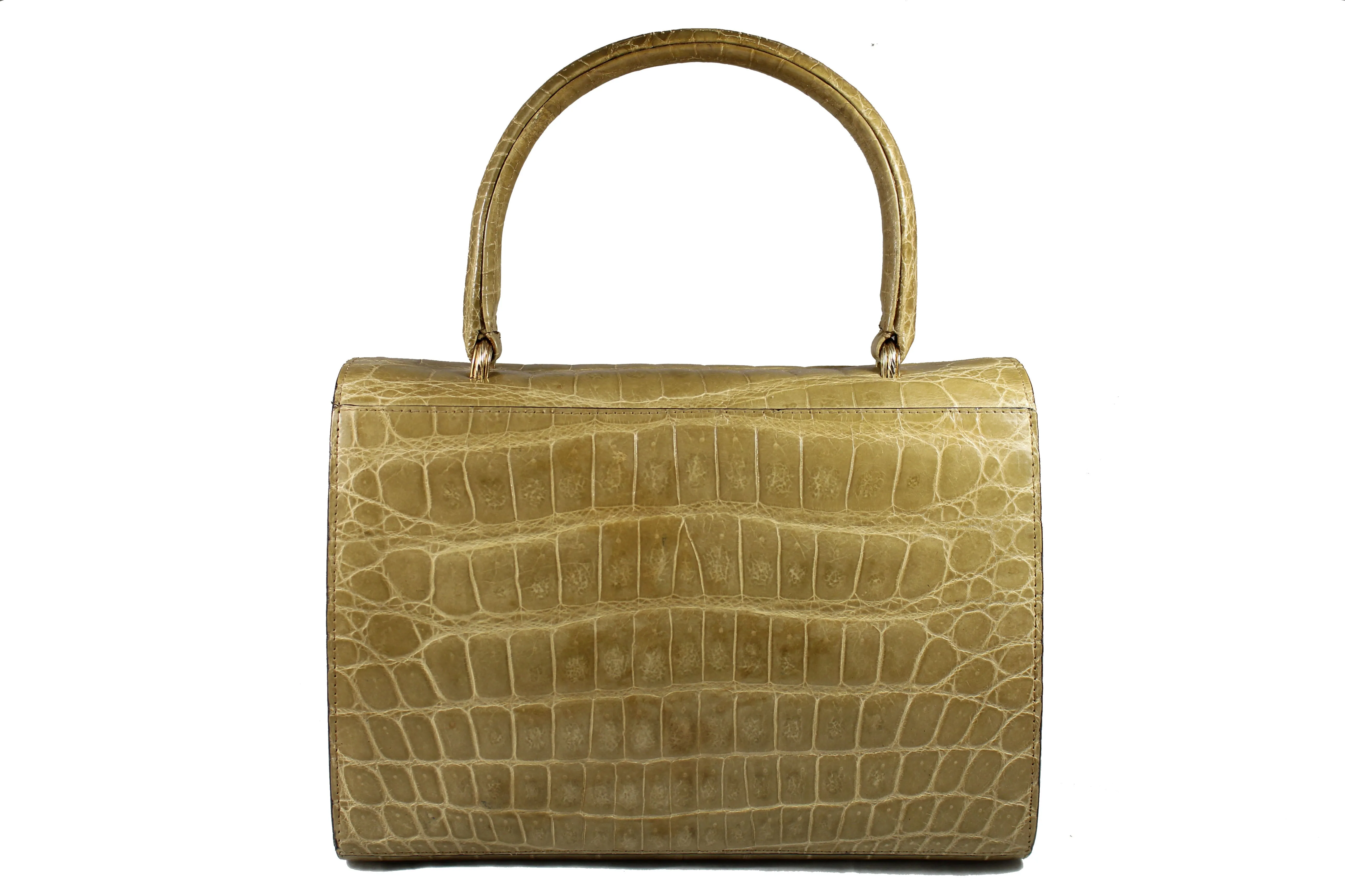 Toasted beige crocodile skin handbag with flap and single handle